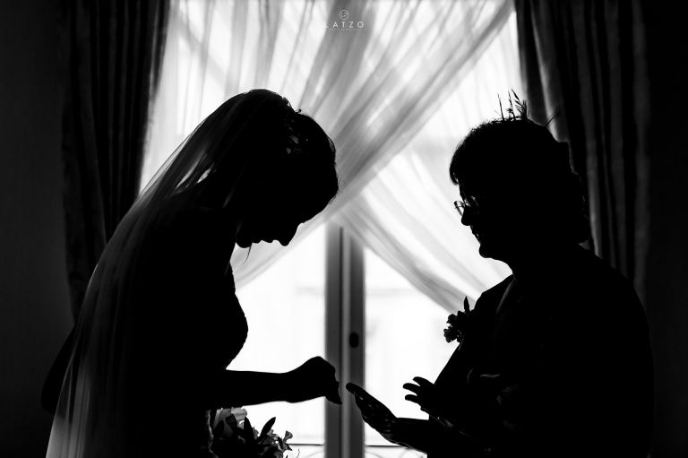 bride in wedding dress with mother