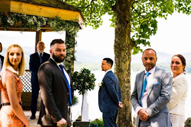 Groom and his intimate wedding party awaiting the bride