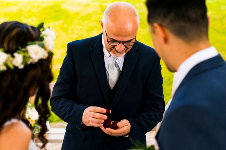 father of the bride presenting the wedding rings