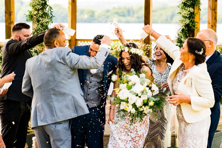Intimate wedding confetti shot in front of langdale chase hotel