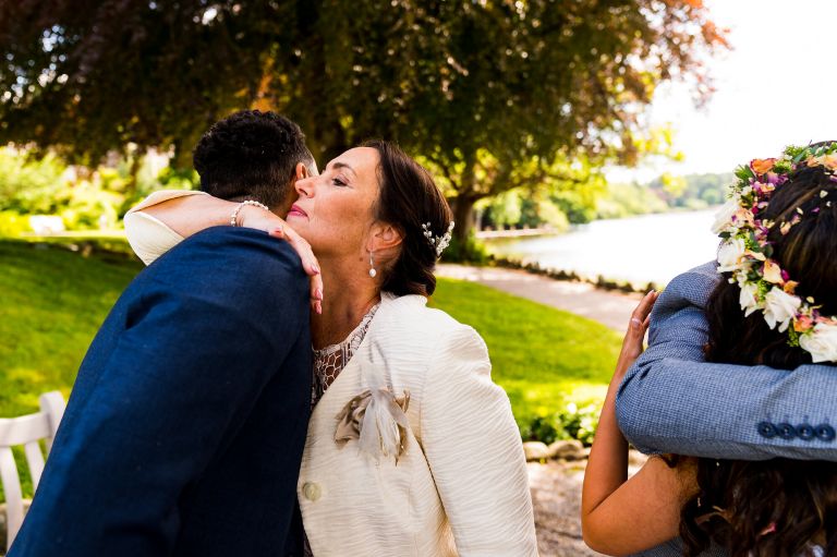 Mother of the groom hugging her son