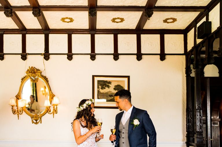 Bride and groom drinking champagne 