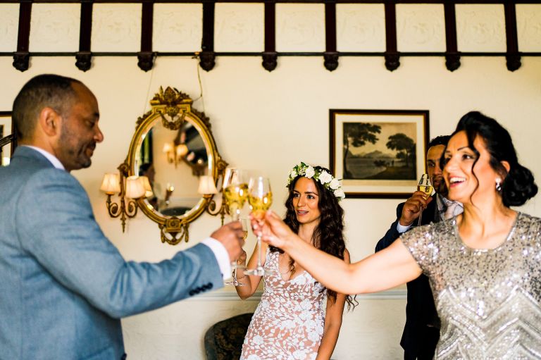 Intimate micro wedding at Lake District wedding Photography first toast with family