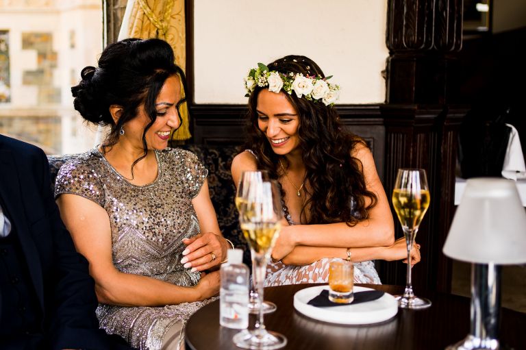 Bride and mother of the bride laughing at Lake District wedding Photography Langdale Chase