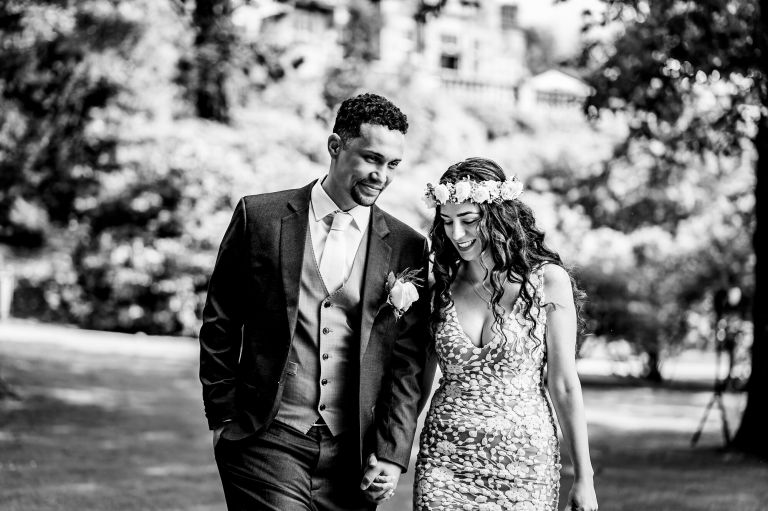 Wedding couple walking in the gardens
