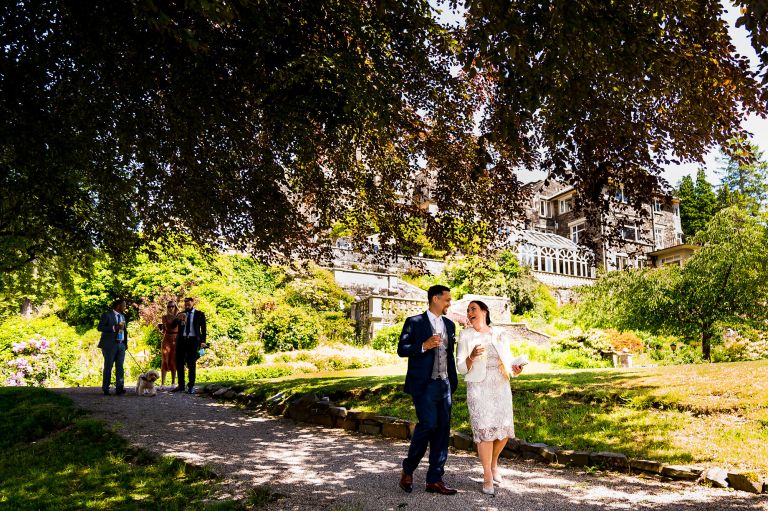 Groom and his mother walking to the wedding